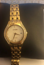 Load image into Gallery viewer, Pre-owned citizen eco drive gold tone white dial  diamond bezel for woman