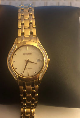 Pre-owned citizen eco drive gold tone white dial  diamond bezel for woman